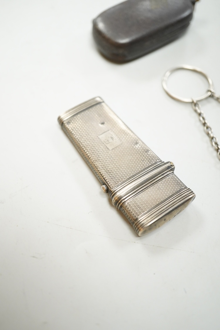 A William IV engine turned silver etui case, maker GC, London, 1836, 61mm, together with a silver purse mount, amethyst? set fob seal and a base metal sovereign case.